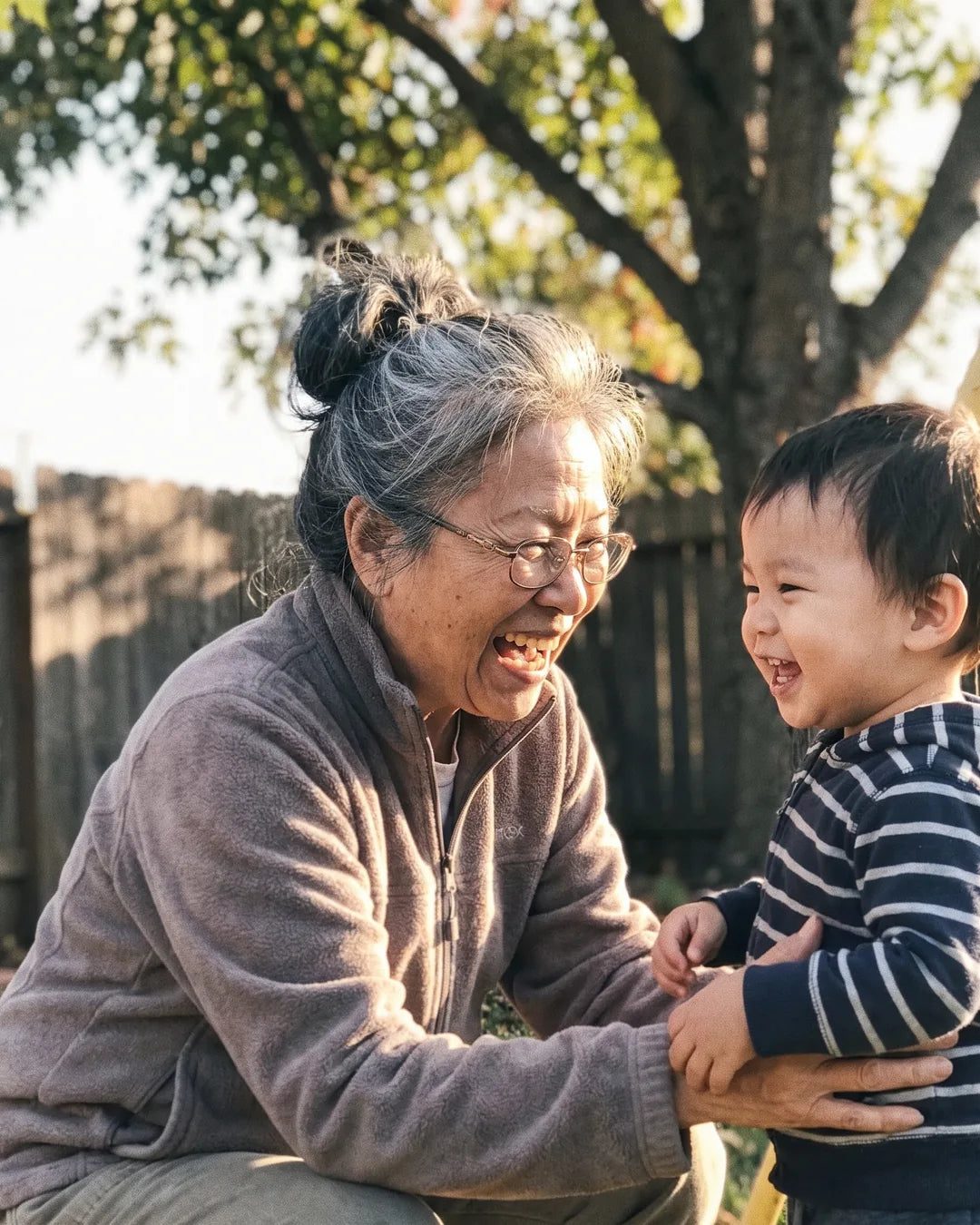 The same woman dancing in her kitchen with a grandchild